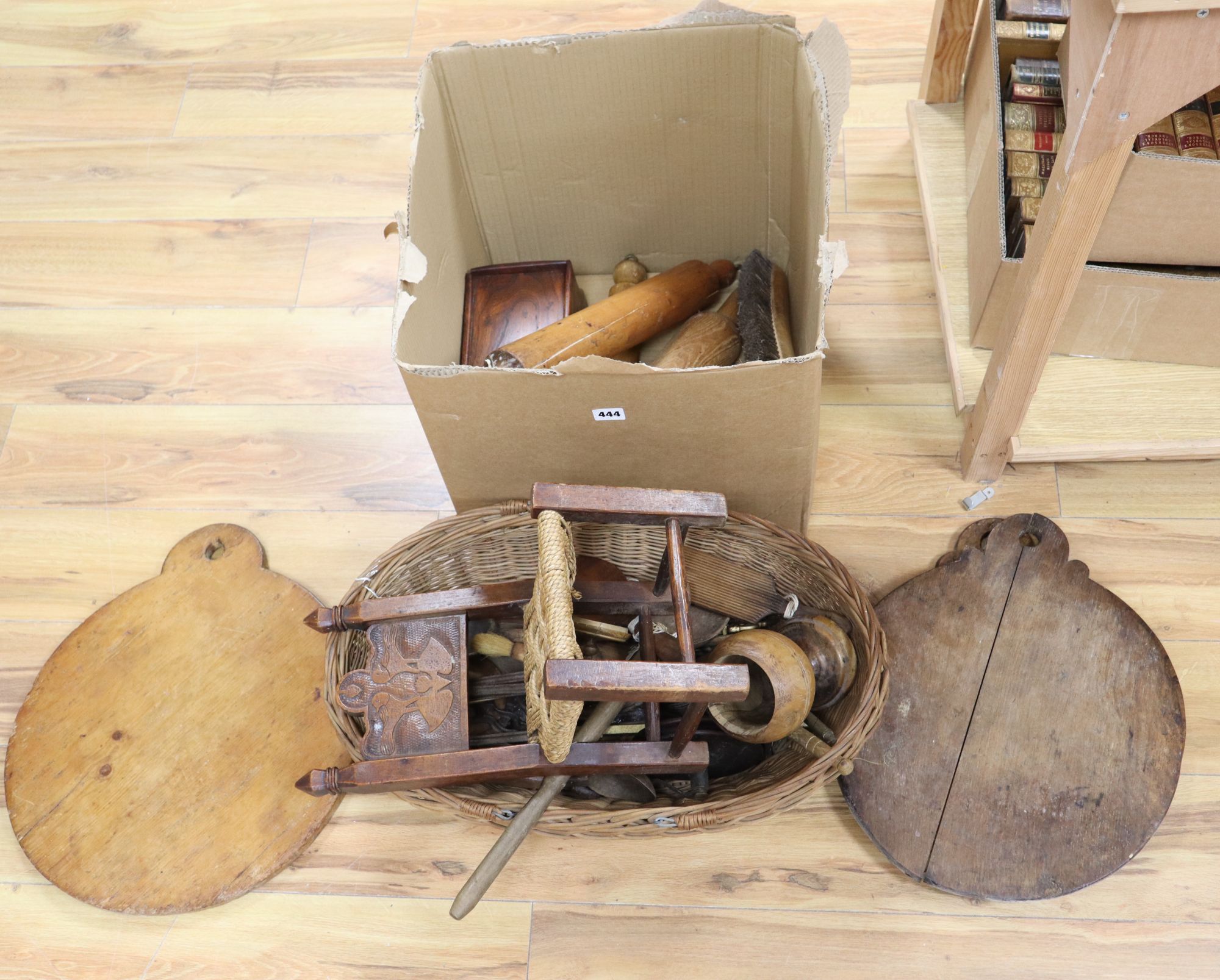 A large quantity of 19th/20th century treen, including an elm candlebox, bread boards, a child's chair, spoons etc.